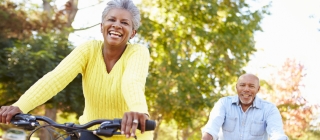 elderly couple biking