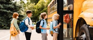 Children getting on a school bus