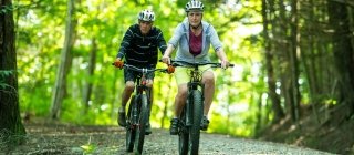 Elderly couple biking in Vermont