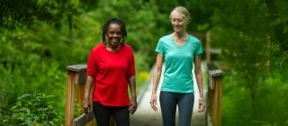 Two women walking on a path in Vermont