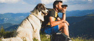 Man and dog hiking in Vermont