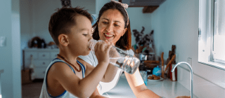 Woman and Child Drinking Water