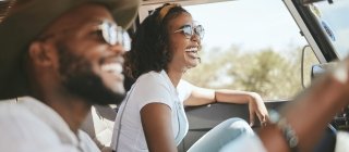 Couple driving with sunglasses