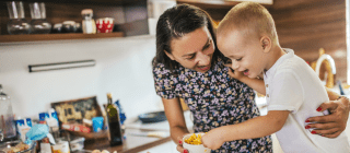 Mother and son making food together