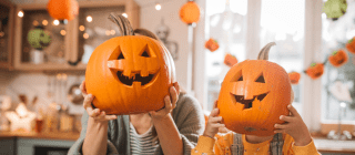 family after carving their pumpkins into jack o lanterns 