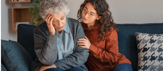 Young woman caring for an older woman with alzheimers