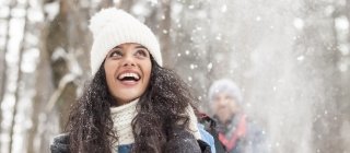 Woman hiking in the woods in winter