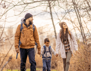 Family walking in the woods in Vermont