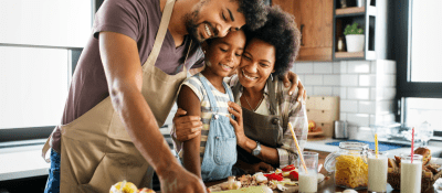 family cooking a healthy meal together