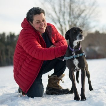 Woman enjoying a Vermont winter with her dog